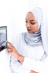 Image showing african woman using smart home screen