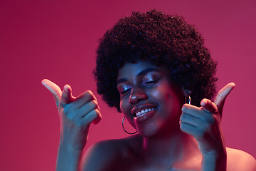 Image showing Portrait of female high fashion model in neon light