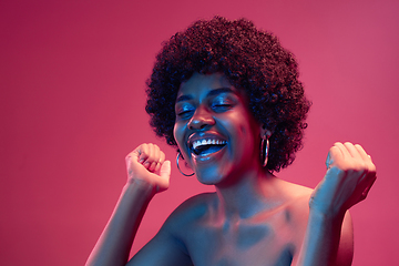 Image showing Portrait of female high fashion model in neon light