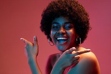 Image showing Portrait of female high fashion model in neon light