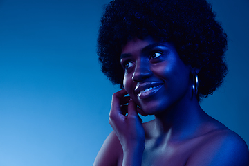 Image showing Portrait of female high fashion model in neon light