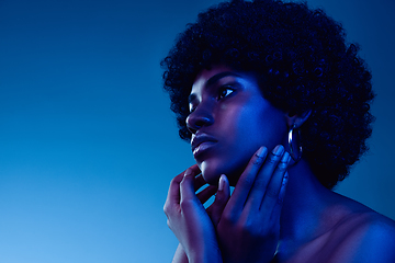 Image showing Portrait of female high fashion model in neon light