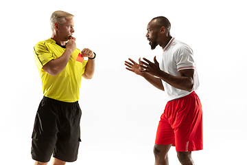 Image showing Football referee showing a red card to a displeased player isolated on white background