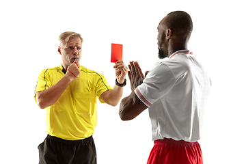 Image showing Football referee showing a red card to a displeased player isolated on white background