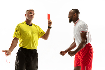 Image showing Football referee showing a red card to a displeased player isolated on white background