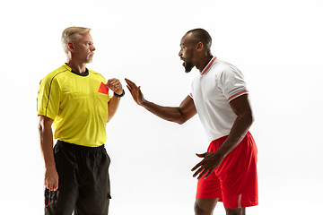 Image showing Football referee showing a red card to a displeased player isolated on white background