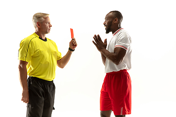 Image showing Football referee showing a red card to a displeased player isolated on white background