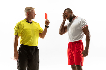 Image showing Football referee showing a red card to a displeased player isolated on white background