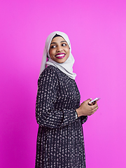Image showing modern muslim business woman using smartphone
