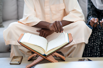 Image showing african couple at home reading quran