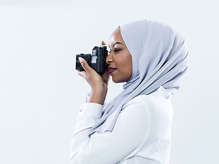 Image showing african modern muslim woman using retro camera