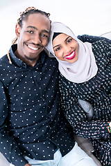 Image showing African Couple Sitting On Sofa Watching TV Together