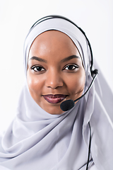 Image showing african customer representative business woman with phone headse