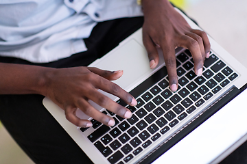 Image showing African student using laptop computer