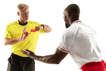 Image showing Football referee showing a red card to a displeased player isolated on white background