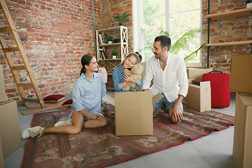 Image showing Adult family moved to a new house or apartment