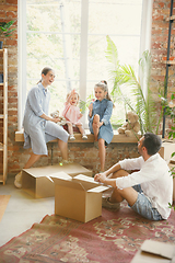 Image showing Adult family moved to a new house or apartment