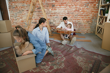 Image showing Adult family moved to a new house or apartment