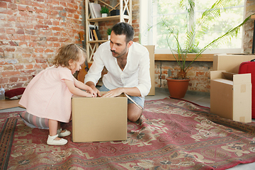 Image showing Young father and his daughter moved to a new house or apartment