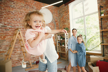 Image showing Adult family moved to a new house or apartment