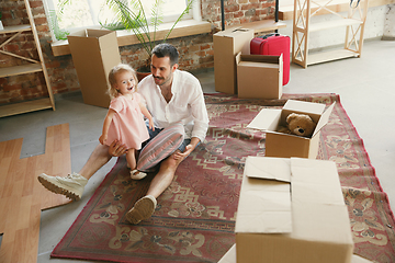 Image showing Young father and his daughter moved to a new house or apartment