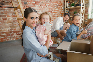 Image showing Adult family moved to a new house or apartment