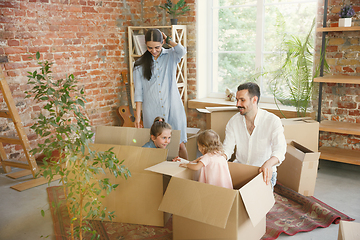 Image showing Adult family moved to a new house or apartment