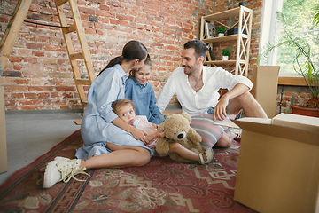 Image showing Adult family moved to a new house or apartment