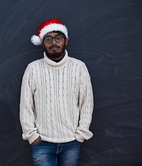 Image showing Indian man wearing traditional Santa  hat  and white sweater