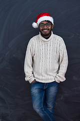 Image showing Indian man wearing traditional Santa  hat  and white sweater