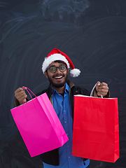 Image showing Indian Santa with shopping bags