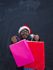 Image showing Indian Santa with shopping bags