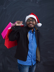 Image showing Indian Santa with shopping bags