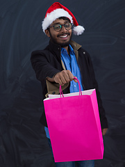 Image showing Indian Santa with shopping bags