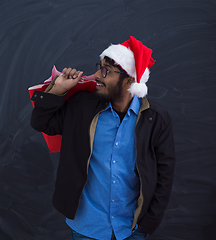 Image showing Indian Santa with shopping bags