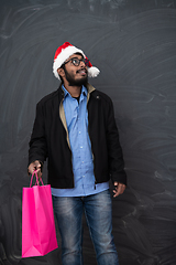 Image showing Indian Santa with shopping bags