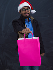 Image showing Indian Santa with shopping bags