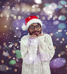 Image showing Indian man wearing traditional Santa  hat  and white sweater