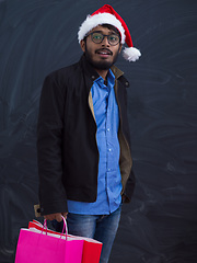 Image showing Indian Santa with shopping bags