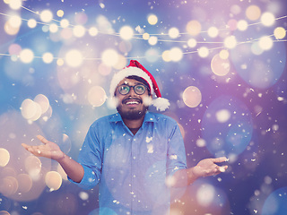 Image showing Indian man wearing traditional Santa Claus hat