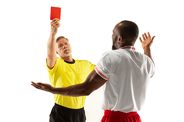 Image showing Football referee showing a red card to a displeased player isolated on white background