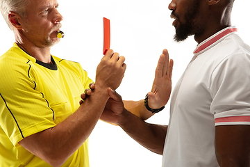 Image showing Football referee showing a red card to a displeased player isolated on white background