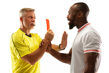 Image showing Football referee showing a red card to a displeased player isolated on white background