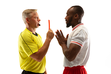 Image showing Football referee showing a red card to a displeased player isolated on white background