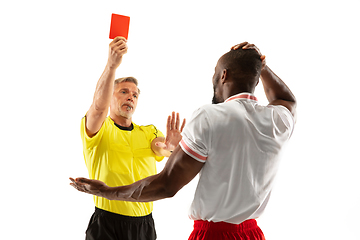 Image showing Football referee showing a red card to a displeased player isolated on white background