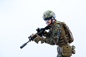 Image showing soldier in action aiming laseer sight optics