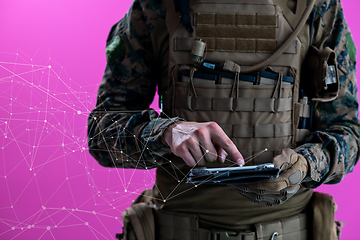 Image showing soldier using tablet computer closeup pixelated