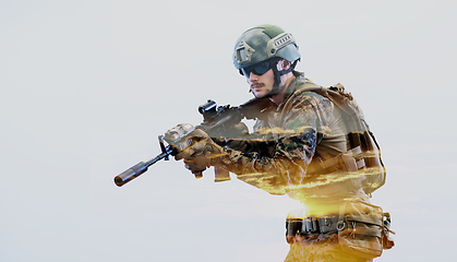 Image showing soldier in action aiming laseer sight optics