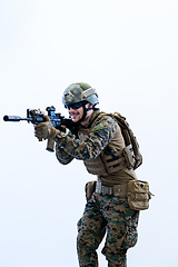 Image showing soldier in action aiming laseer sight optics