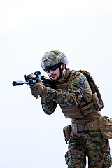 Image showing soldier in action aiming laseer sight optics